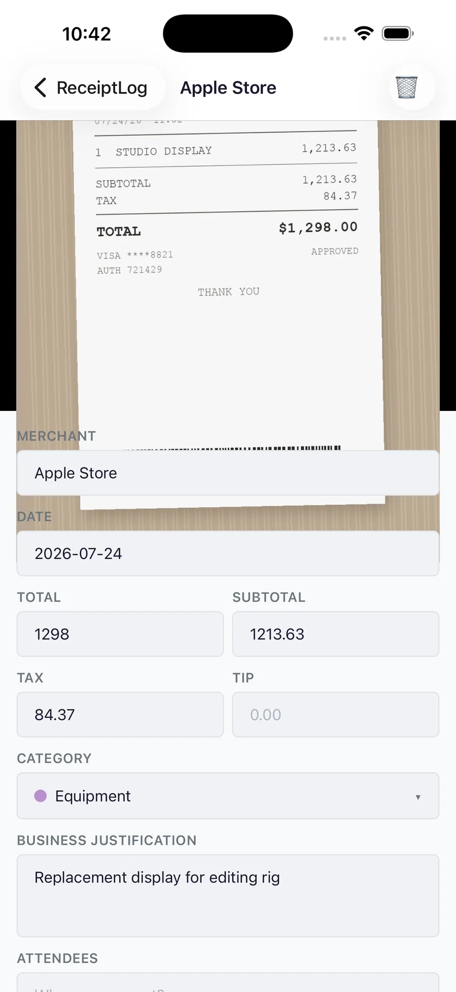 A receipt's detail screen with the original photo above editable merchant, date, total and tax fields
